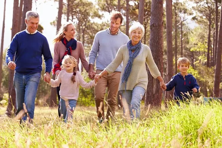 A multi-generation Orange County family walking together outdoors
