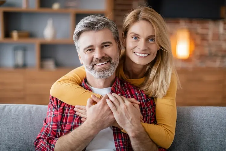 A mature Orange County couple talking through their health coverage options